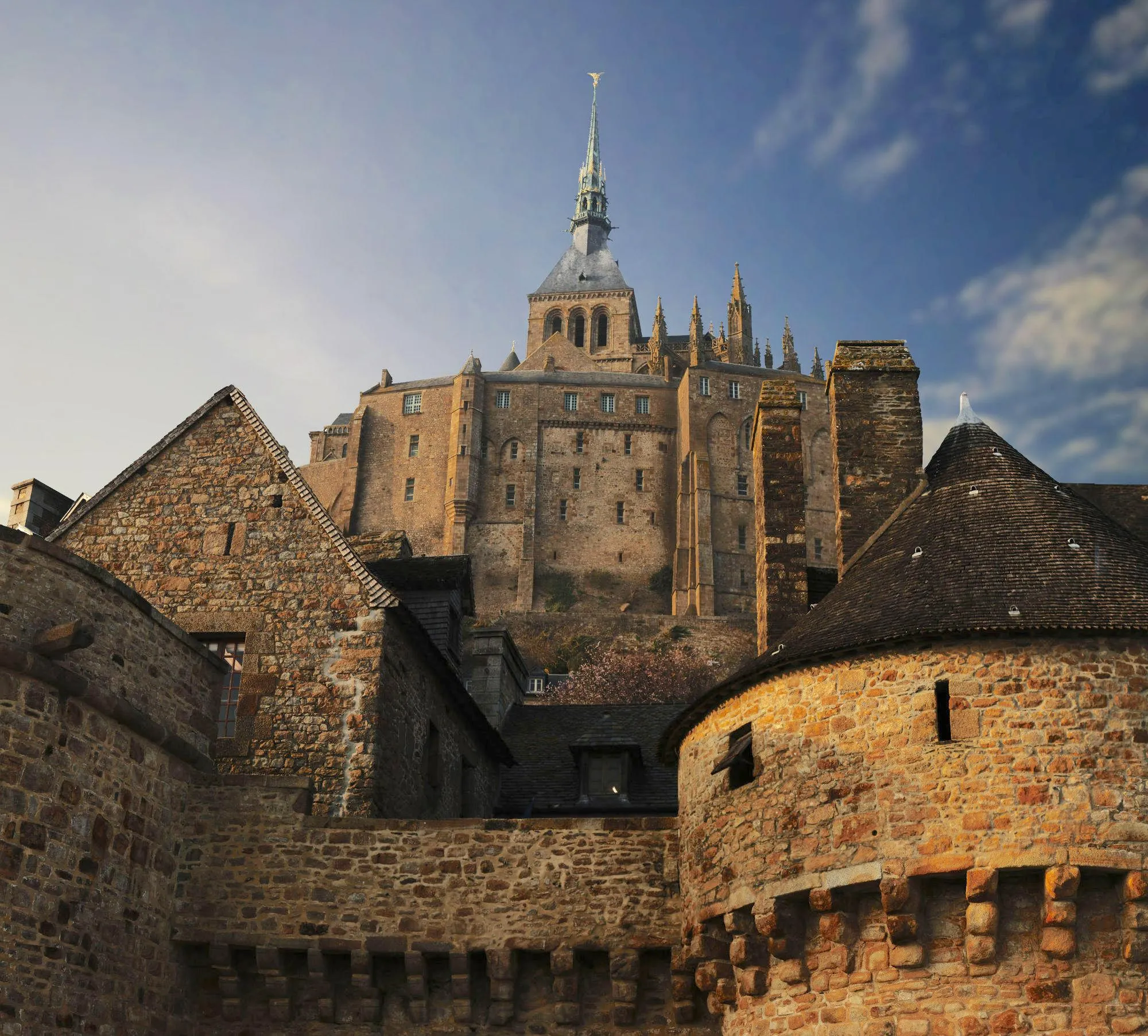 Cross-section style view showing massive crypt piers supporting Gothic superstructure at Mont-Saint-Michel
